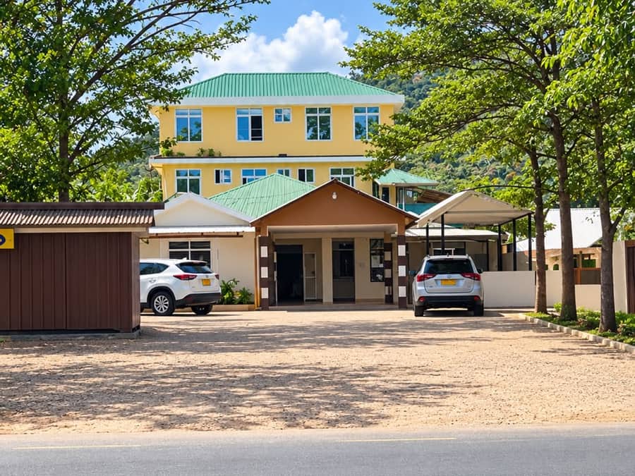 Khusho Health Center building with its green roof and covered entrance