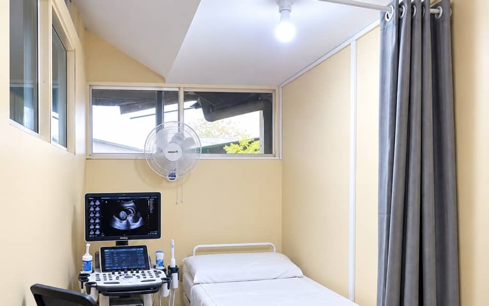 Ultrasound room at Khusho Health Center with the scanner, monitor and examination bed